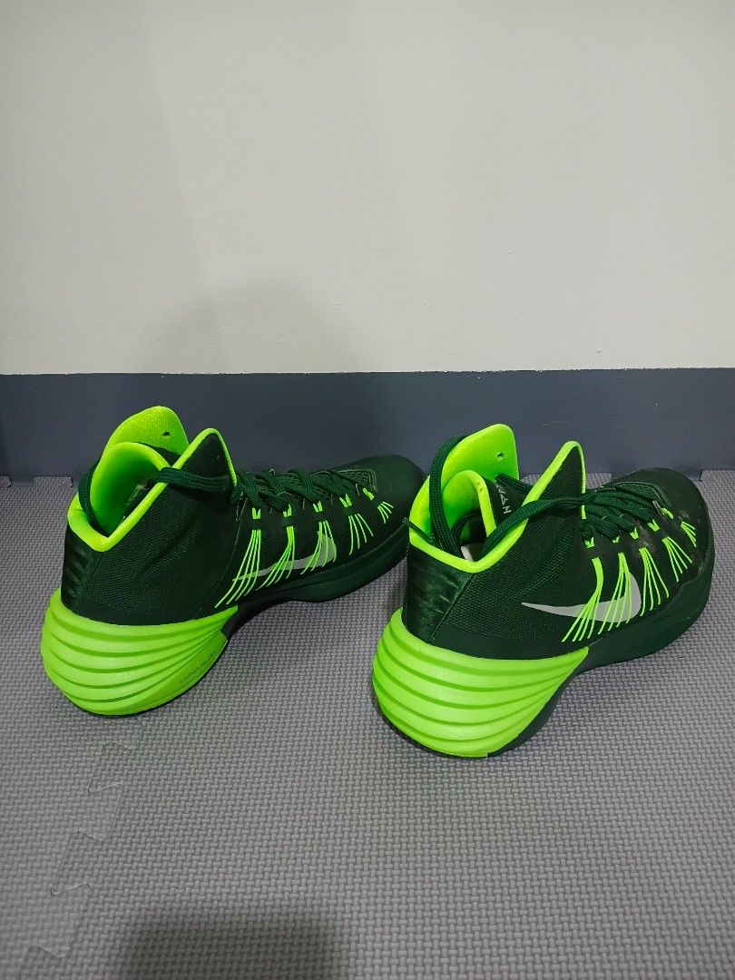 Nike Hyperdunk Green Basketball Shoes (Category: Sneakers) located in Marikina City. Submitted by littledearthings (Listing ID 1429903943, Image 3). Description: These Nike Hyperdunk basketball shoes feature a vibrant green color. The shoes have a high-top design with a cushioned sole and visible Nike swoosh. The size is US 11.5, UK 10.5, EUR 45.5, and 29.5 cm. .