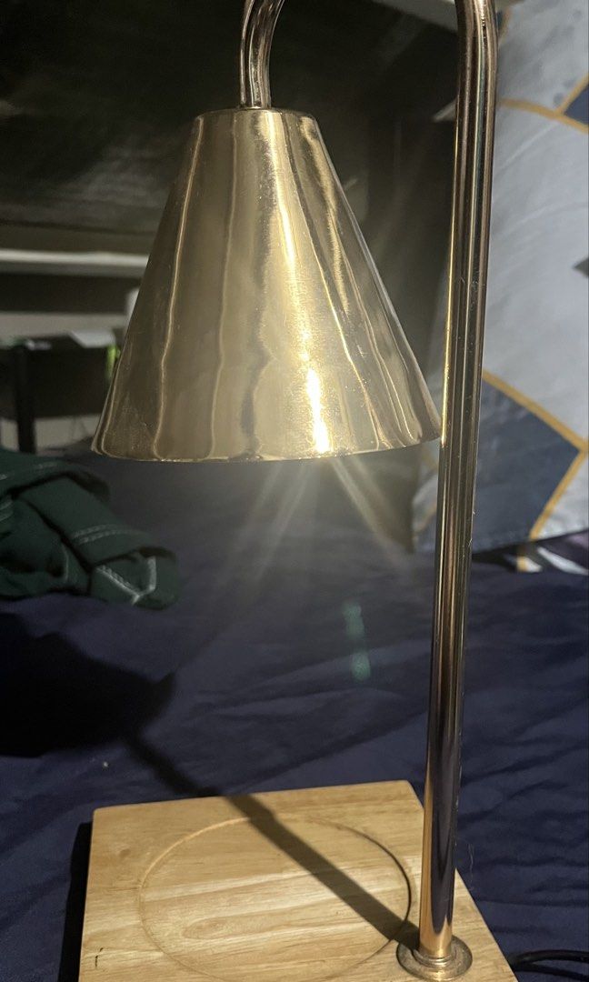 Nordic Wax Candle Warmer (Category: Other Home Decor) located in Taguig. Submitted by random.stuff31 (Listing ID 1429974654, Image 1). Description: ✨ Candle Warmer Lamp (Lightly Used) – Light Bulb Included ✨ Elegant and functional candle warmer lamp with a modern gold finish and wooden base. Perfect for safely melting your favorite scented candles without an open flame. ✔️ Lightly used – still in great condition ✔️ Includes working light bulb (re