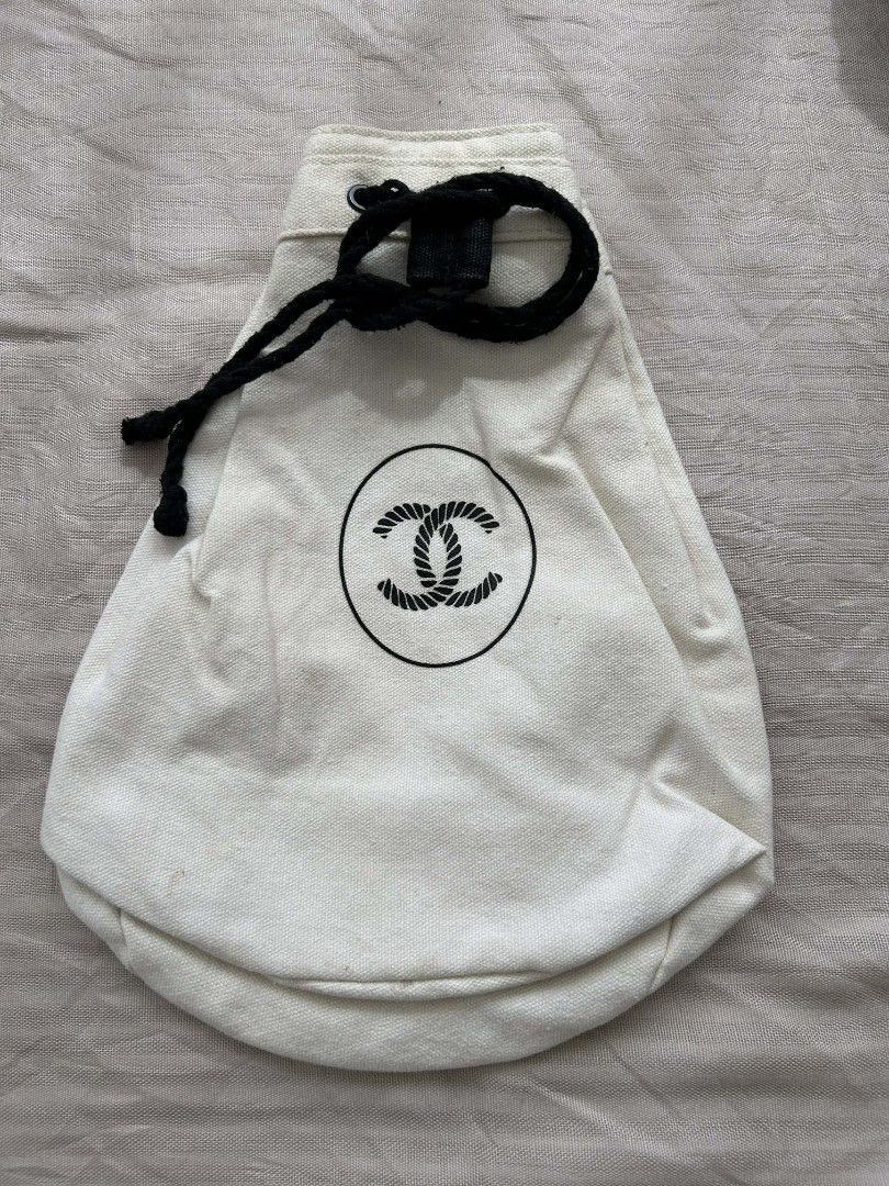 Off-White Drawstring Bag (Category: Luxury Bags & Wallets) located in Calamba. Submitted by merrymerida (Listing ID 1429877150, Image 1). Description: Off-white drawstring bag. Features a three-compartment design with black drawstrings. Includes a small tag at the bottom. Perfect for carrying small items..