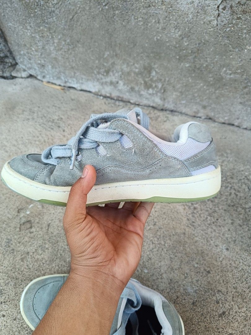 Ollie skate shoes (Category: Sneakers) located in Tubigon. Submitted by thrift_mac (Listing ID 1429858579, Image 2). Description: Osiris NYC 83 skate shoes in gray. Features a suede upper with a padded tongue and collar for comfort. The shoes have a lace-up closure and a durable rubber outsole. The insole has a logo. The shoes have a light green sole..