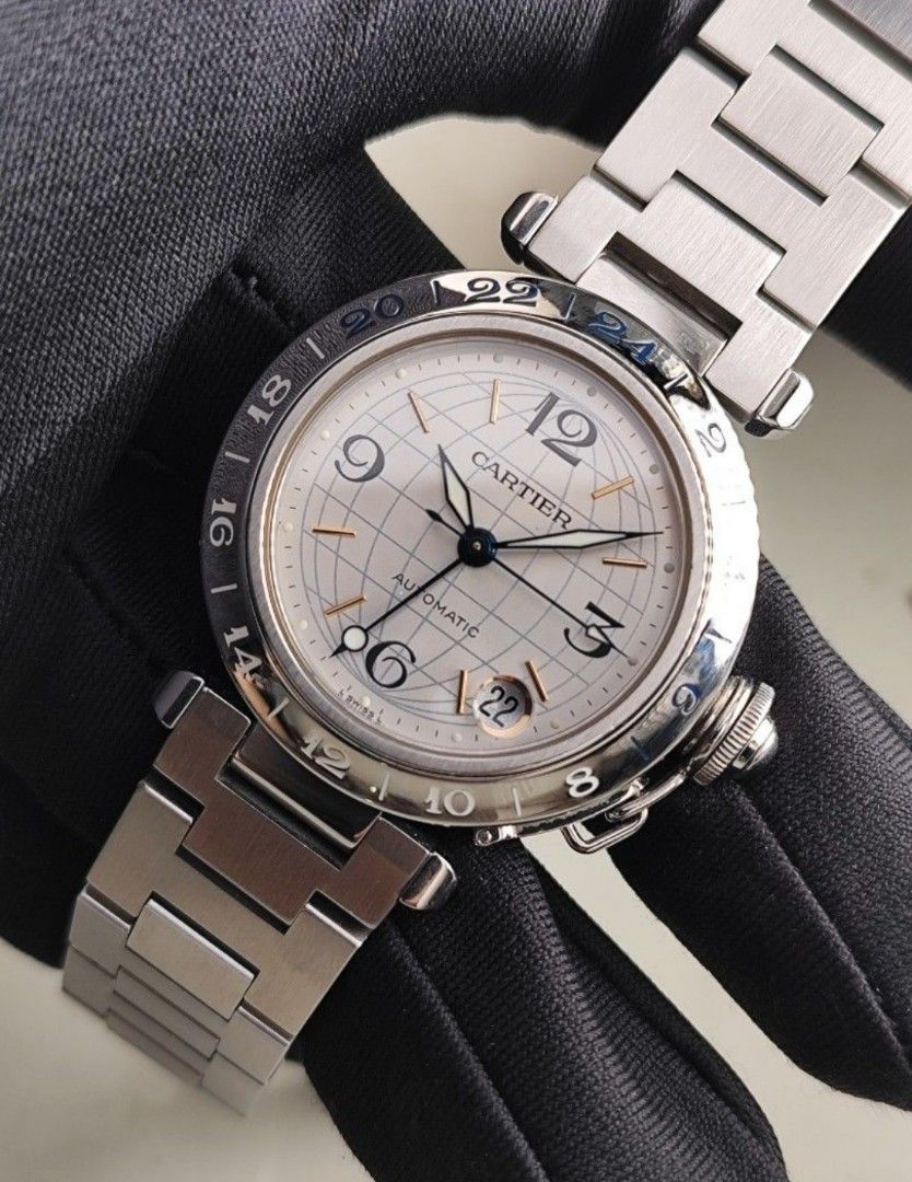 Original Cartier Pasha GMT 35mm (Category: Luxury Watches) located in San Juan City. Submitted by exclusivelyours (Listing ID 1429893357, Image 1). Description: Cartier Pasha GMT 35mm Silver globe dial Automatic Ref 2377 9/10 condition Inclusions: watch, original bracelet fit to approx 6.8" wrist, Cartier AM box and watch case *watch is verified on Cartier Care website - with certificate *photo reference on 6.5" wrist.