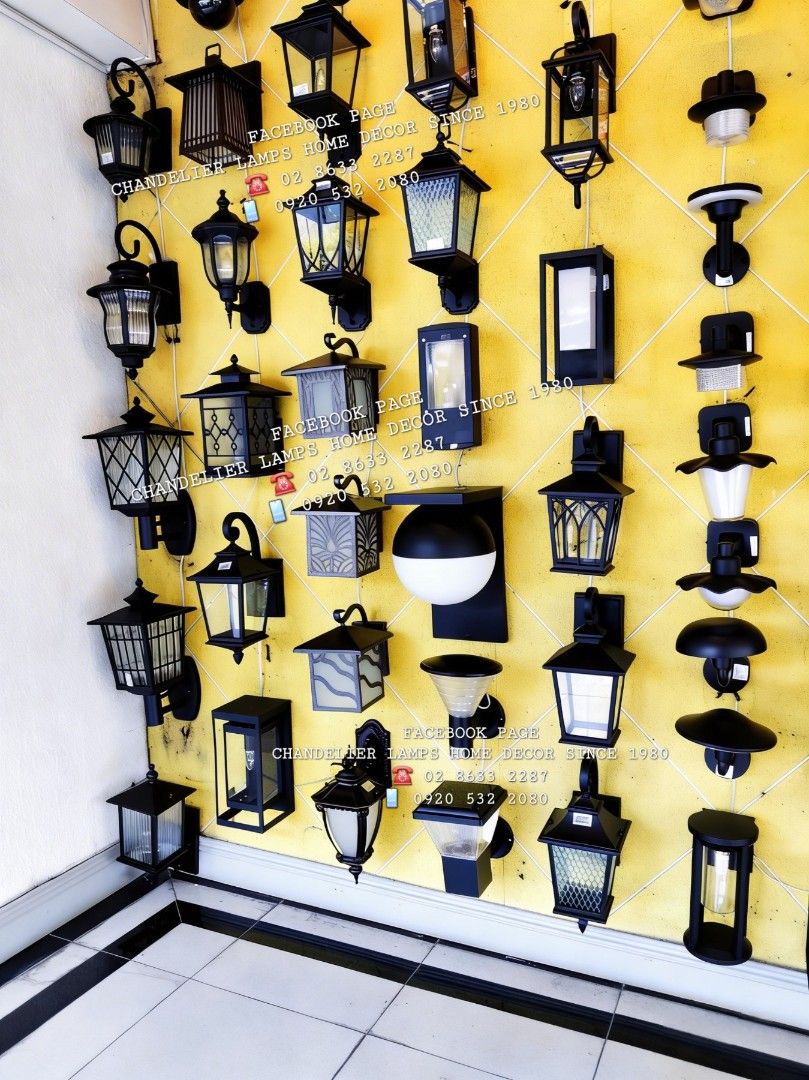 Outdoor Wall Lamps - Various Designs (Category: Lighting) located in Manila. Submitted by aranyailawan (Listing ID 1429839916, Image 1). Description: Variety of outdoor wall lamps available. Designs include rectangular, lantern-style, and modern spherical options. Lamps are black and designed for wall mounting. Several styles feature glass panels. Perfect for adding ambient lighting to your outdoor spaces. Contact for inquiries and specific desig