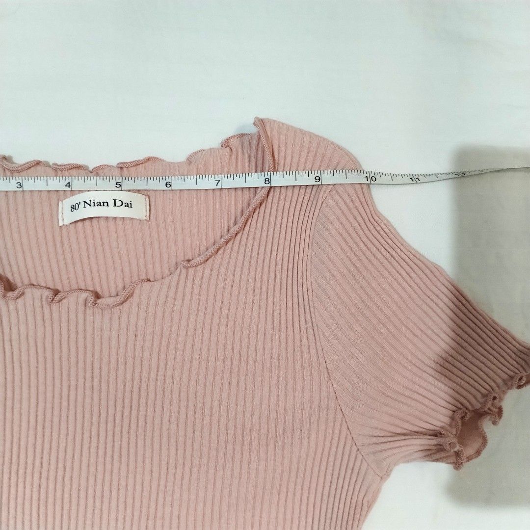 Pink ribbed lettuce hem top shirt (Category: Shirts) located in San Fernando. Submitted by decluttrwithella (Listing ID 1429913708, Image 2). Description: Negotiable! Stretchy Size: XS/S, measurements are shown in the photos (inches) Color: Light dusty rose pink🩷 Condition: No flaws!👌 PLS READ👇 - Accepting payments thru Gcash - Shipping thru J&T - No when worn photos unless uploaded - Serious buyers only! No cancellations, refunds, or exchange