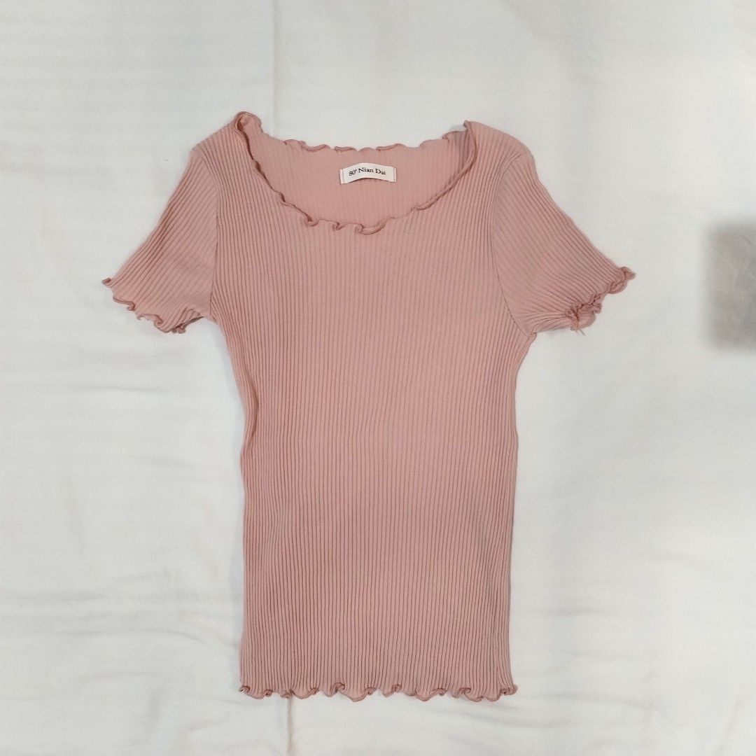 Pink ribbed lettuce hem top shirt (Category: Shirts) located in San Fernando. Submitted by decluttrwithella (Listing ID 1429913708, Image 1). Description: Negotiable! Stretchy Size: XS/S, measurements are shown in the photos (inches) Color: Light dusty rose pink🩷 Condition: No flaws!👌 PLS READ👇 - Accepting payments thru Gcash - Shipping thru J&T - No when worn photos unless uploaded - Serious buyers only! No cancellations, refunds, or exchange