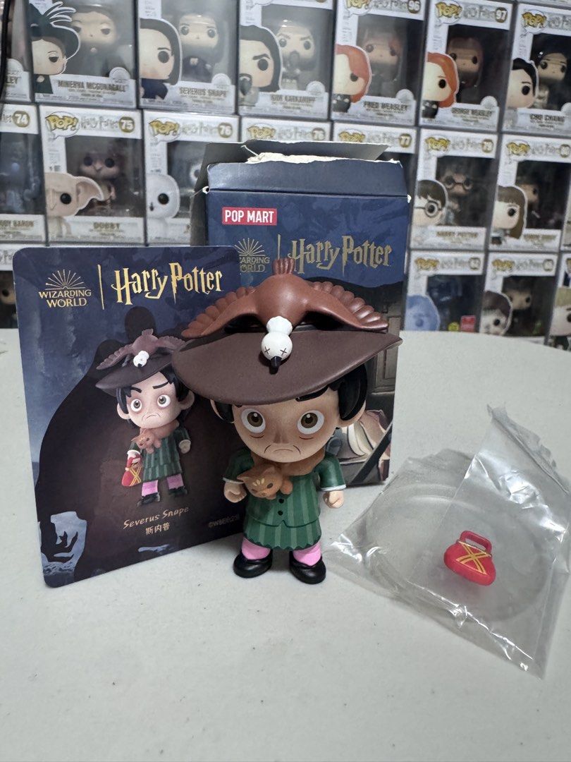 POP MART Harry Potter Severus Snape Figure (Category: Designer & Blind Box Toys) located in Marikina City. Submitted by jaymspj (Listing ID 1429880148, Image 1). Description: POP MART Harry Potter figure features Severus Snape. The figure comes with its original box and accessories. It depicts Snape in his signature outfit, complete with a bird on his hat and a small bag. The figure is part of the Wizarding World collection..
