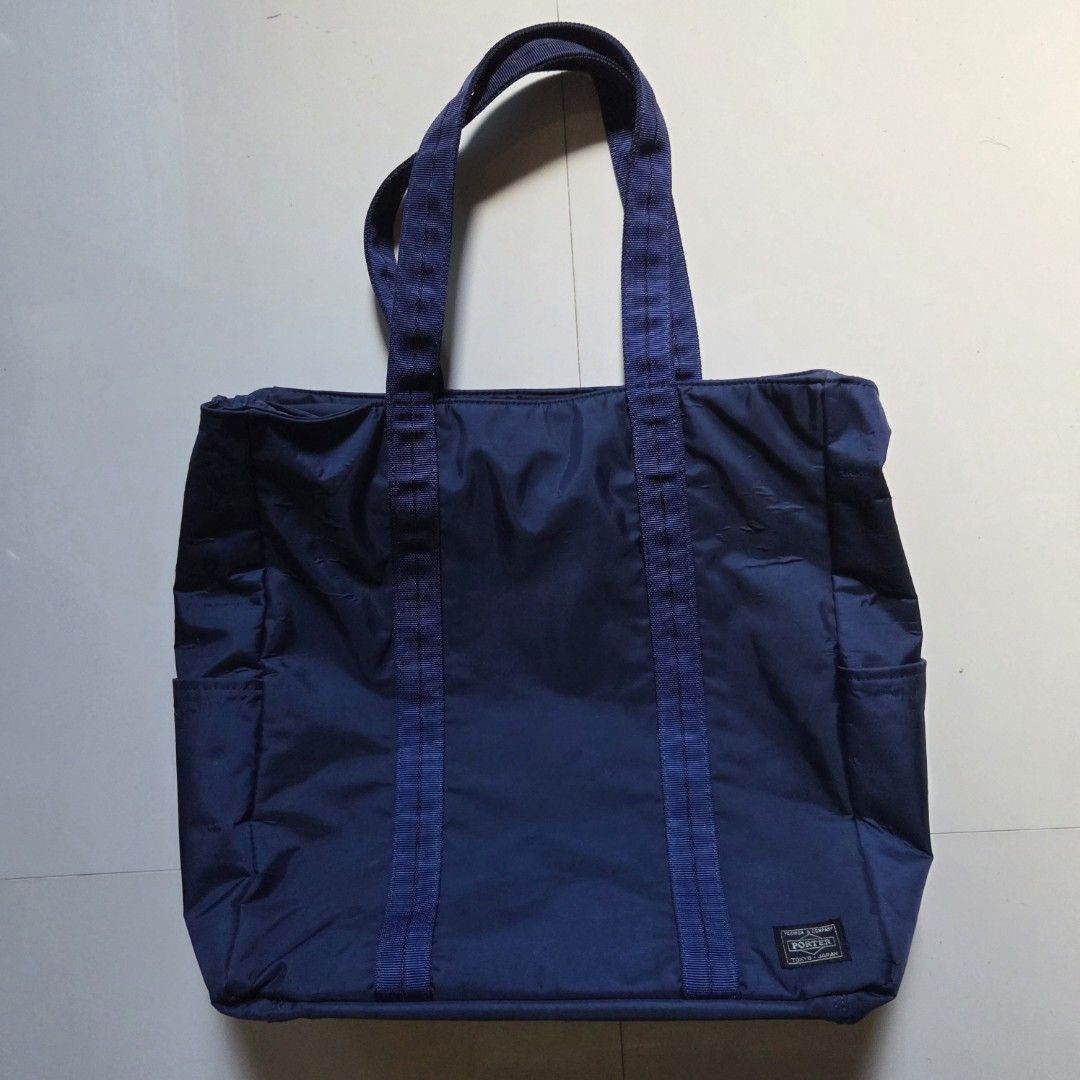 PORTER YOSHIDA & CO. Tote Bag (Category: Tote Bags) located in Tayabas. Submitted by old.dani (Listing ID 1429870037, Image 1). Description: Dimensions: 495 mm x 482 mm x 127 mm (H x L x W) Overall Height (w/ strap) - 622.5 mm Volume: 30L Color: Navy Blue Hardware: Zipper Material: Front: Nylon twill (Surface: weakly water repellent) (Back: PVC processing) Cordura ballistic nylon (back side: polyurethane processing) Back: Nylon ripstop (Surface: 