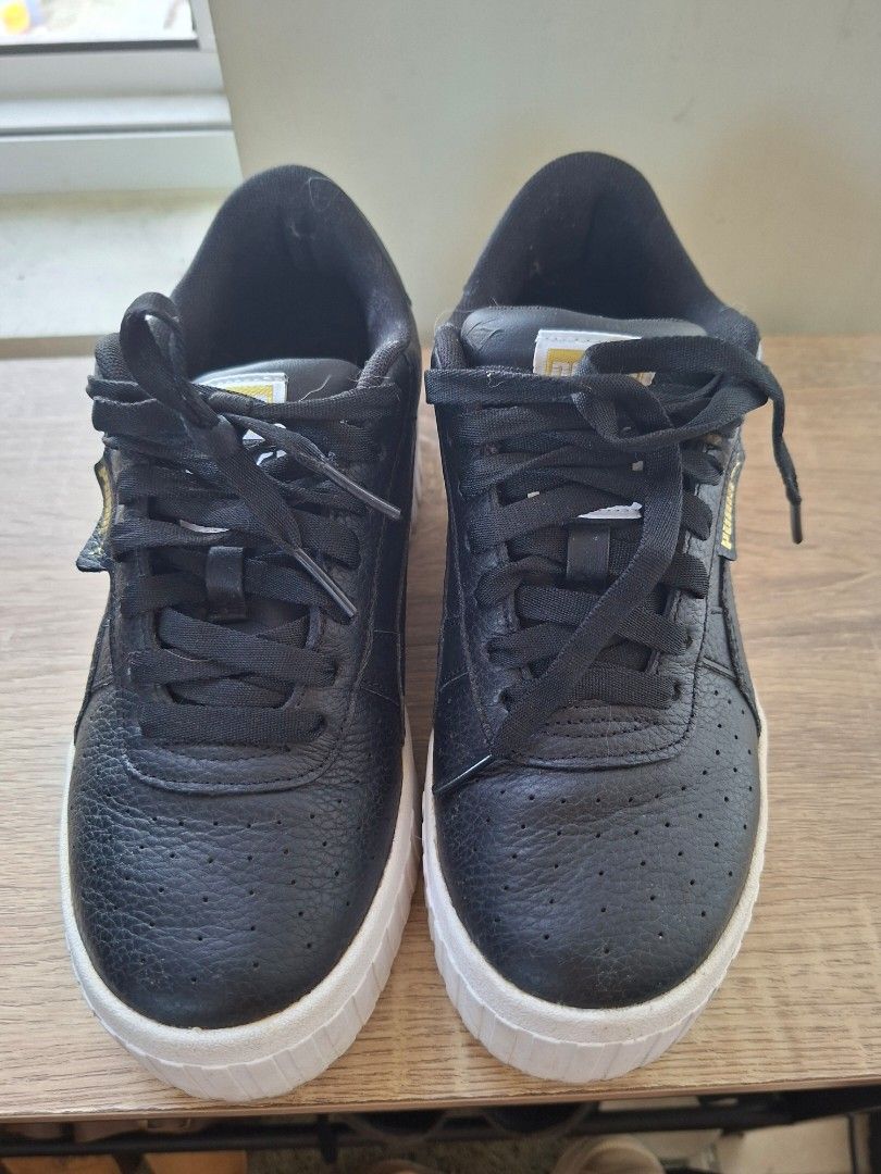 Puma Cali Wedge Black Sneakers (Category: Sneakers) located in Pasig City. Submitted by zmabel (Listing ID 1430016932, Image 2). Description: Fits 24.5cm wide feet well. Worn few times, kept in storage. Can use cleaning. RFS: Decluttering Delivery fee via grab/lala/etc to be shouldered by the buyer..