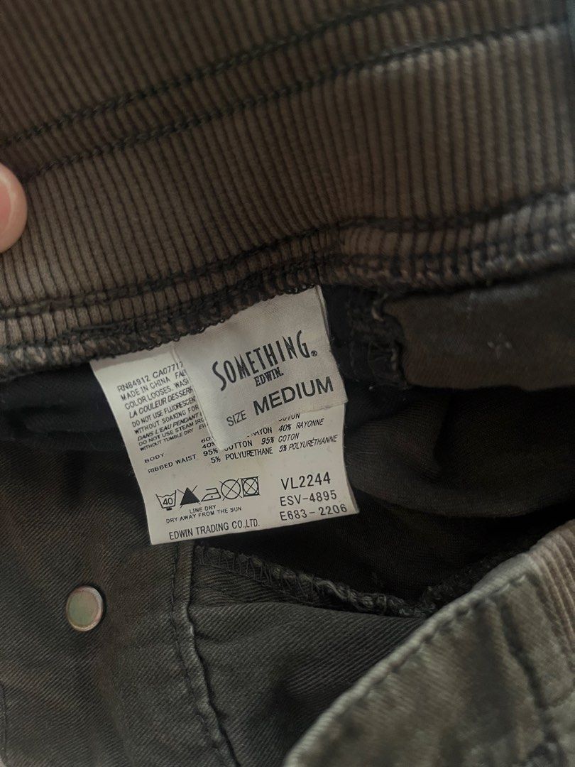 Something Edwin Cargo Pants - Medium (Category: Jeans) located in Pasay City. Submitted by fromtheashes (Listing ID 1429921435, Image 3). Description: These cargo pants from Something Edwin are in a dark olive green color. They feature multiple pockets and a comfortable fit with ribbed waist and cuffs. The size is medium. Made with a blend of cotton and polyurethane. The pants have a button closure and a stylish design..