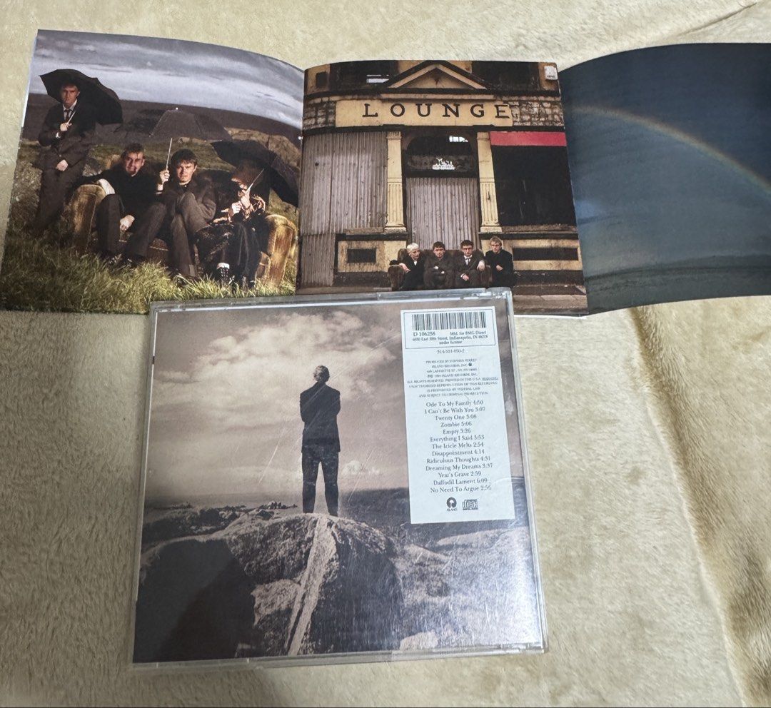 The Cranberries - No Need to Argue CD (Category: CDs & DVDs) located in Pasig City. Submitted by proteinboy6 (Listing ID 1429864670, Image 3). Description: Original CD of The Cranberries' album "No Need to Argue". Features the band on the cover and includes the CD and booklet with lyrics and photos. The CD case is intact. The album includes tracks like "Ode to My Family", "Zombie", and "Linger"..