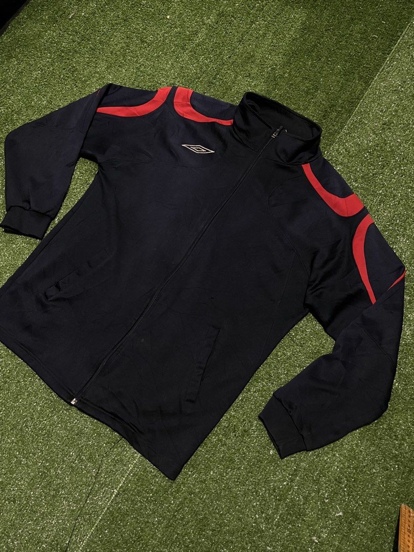 Umbro Track Jacket Navy Blue Red Accents (Category: Coats, Jackets and Outerwear) located in Sagbayan (Borja). Submitted by abejaronke97521 (Listing ID 1429882507, Image 2). Description: 28 length 21 width.