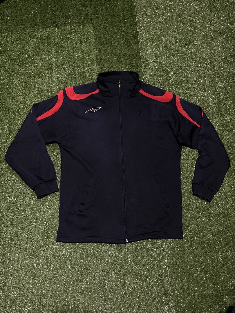 Umbro Track Jacket Navy Blue Red Accents (Category: Coats, Jackets and Outerwear) located in Sagbayan (Borja). Submitted by abejaronke97521 (Listing ID 1429882507, Image 1). Description: 28 length 21 width.