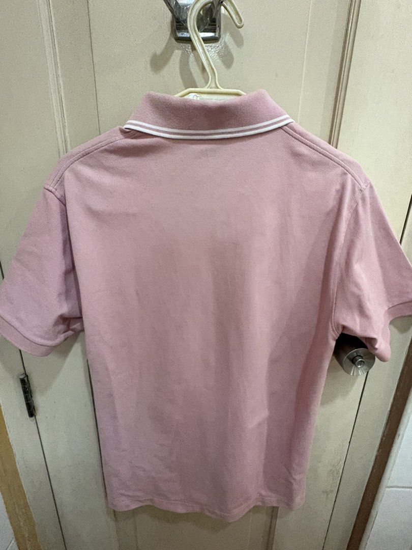 UNIQLO Pink Polo (Size S) (Category: Tshirts & Polo Shirts ) located in Makati City. Submitted by jarled (Listing ID 1429931389, Image 2). Description: - Uniqlo polo shirt - Color: Pink - Size: S - Features a classic collar with white trim - Made in Vietnam - Short sleeves - Button-up placket - Perfect for everyday wear.