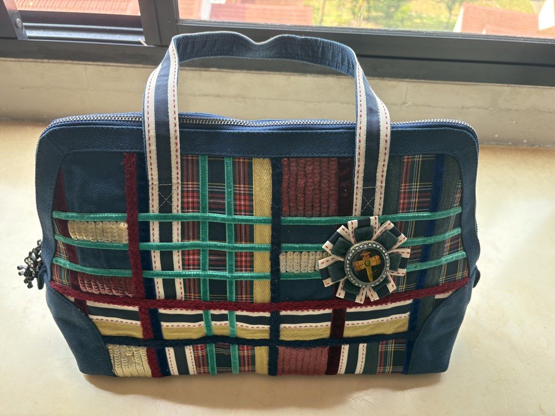 Unique Patchwork Handbag (Category: Shoulder Bags) located in Singapore. Submitted by green.apple7 (Listing ID 1429852286, Image 1). Description: Hand made patchwork handbag with a unique design. Features a zip closure and sturdy handles. The interior is lined with a dark fabric. Includes decorative charms on the zipper. A great statement piece! Dimensions L36cm H 25cm W 12cm.