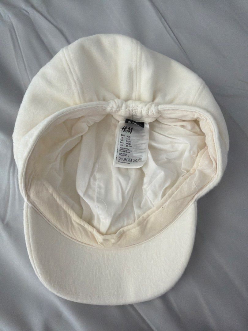 White beret hat (Category: Hats & Beanies) located in Manila. Submitted by spring2025 (Listing ID 1429895453, Image 2). Description: Minor stain inside (see 2nd photo).