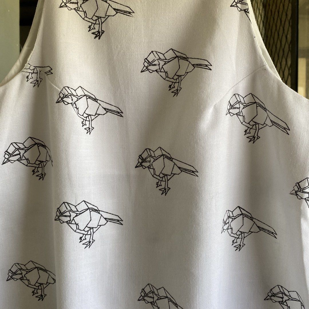 Canvas bird print dress (Category: Dresses) located in Imus. Submitted by shesleavinghome (Listing ID 1429947139, Image 2). Description: White canvas dress with bird print. Features a halter neckline and straps. The dress has a simple, A-line silhouette in canvas cotton fabric. With inner lining. Fits small to medium Message for more details Thank you!.
