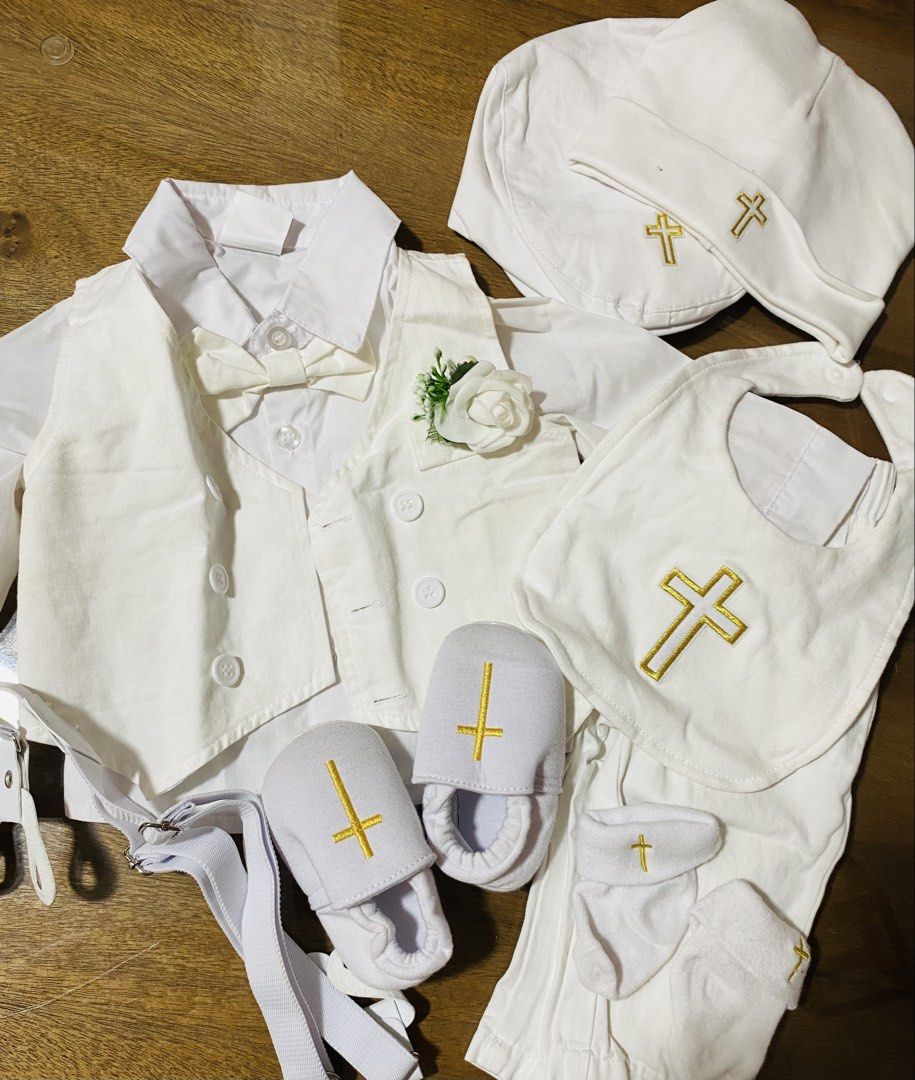 White Christening Outfit Set (Category: Babies & Kids Fashion) located in San Pedro. Submitted by chinitagrace21 (Listing ID 1429857950, Image 1). Description: Complete christening outfit set in white. Includes a shirt, vest, pants, bow tie, hat, bib, socks, and shoes. The outfit features a cross design on the hat, bib, socks, and shoes. A small flower is attached to the vest. Perfect for a special occasion..