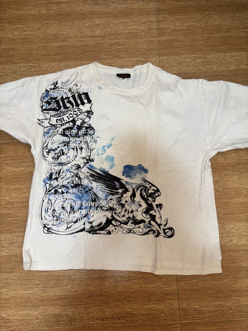 y2k skin industries graphic tee (Category: Tshirts & Polo Shirts ) located in Taytay. Submitted by chippylala (Listing ID 1429968000, Image 1). Description: — has small hole behind the right sleeve, see 3rd pic; has minor stains as well — color may vary due to lighting — MOD: lalamove shouldered by the buyer — MOP: gcash, bpi 📌 strictly no exchange, returns, & cancellations.