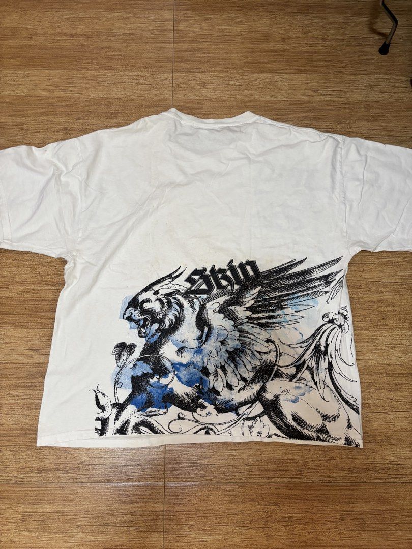 y2k skin industries graphic tee (Category: Tshirts & Polo Shirts ) located in Taytay. Submitted by chippylala (Listing ID 1429968000, Image 2). Description: — has small hole behind the right sleeve, see 3rd pic; has minor stains as well — color may vary due to lighting — MOD: lalamove shouldered by the buyer — MOP: gcash, bpi 📌 strictly no exchange, returns, & cancellations.
