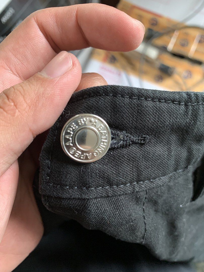 AAPE by A Bathing Ape Shorts (Category: Shorts) located in Baguio. Submitted by brix6699 (Listing ID 1435218728, Image 3). Description: Black shorts from AAPE by A Bathing Ape. Features the AAPE logo on the back. Made of 100% cotton. Includes a button with the AAPE logo. Size is 180/86A. The shorts have a camouflage lining. Size L .