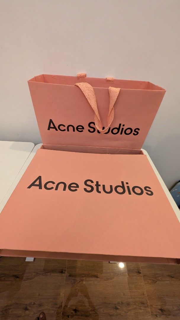 Acne Studios Box (Category: Luxury Accessories) located in Manila. Submitted by connor____lee (Listing ID 1435280703, Image 2). Description: - Authentic Acne Studios box - Pink color - Black brand name print - Includes matching pink tissue paper - Great for gifting or storage.