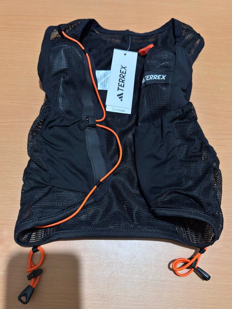 Adidas TERREX CLIMACOOL Trail Vest with 2 bottles (Category: Activewear) located in Mandaluyong City. Submitted by sm1212 (Listing ID 1435312051, Image 1). Description: Never been used, bought in Malaysia Size: Small Color: Black Main Material: 100% Polyester(100% Recycled), Mesh Comes with 2 collapsable bottles (still sealed with plastic) RFS: Too small for me. .