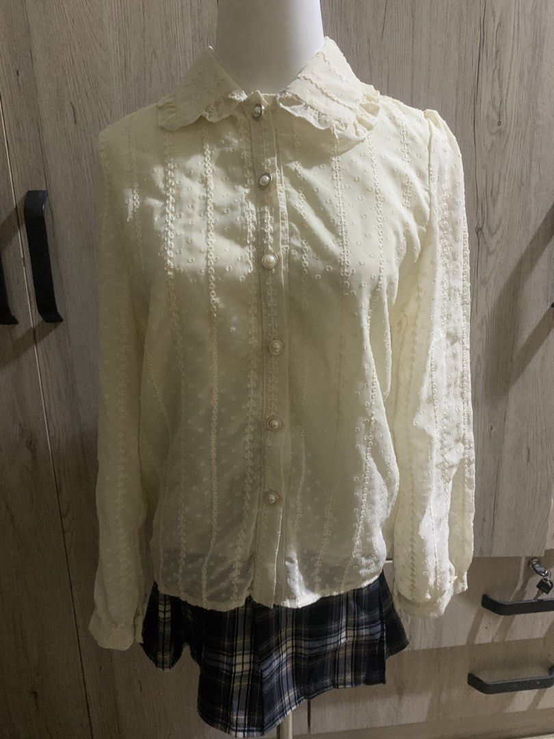 Beige blouse (Category: Blouses) located in Cavite. Submitted by archimage (Listing ID 1435272625, Image 2). Description: - Beige blouse - Size S - Features pearl buttons - Delicate design - no flaws - used once as an inner top for my lolita outfit.