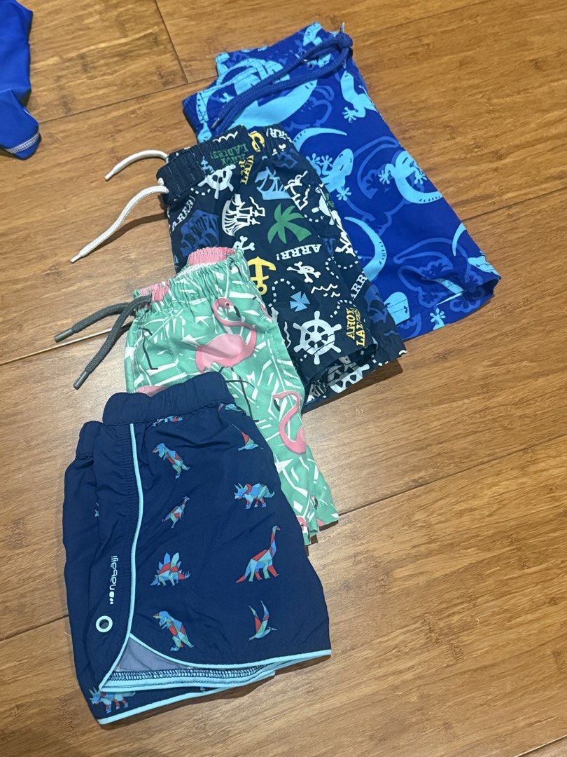 Boys' Swim Shorts - Assorted Designs (Category: Babies & Kids Fashion) located in Quezon City. Submitted by zerinap (Listing ID 1435217326, Image 1). Description: - Boys' swim shorts set - Features dinosaur, flamingo, anchor, and lizard designs - All shorts have drawstring waistbands - Various shades of blue and green - Ideal for beach and pool activities.