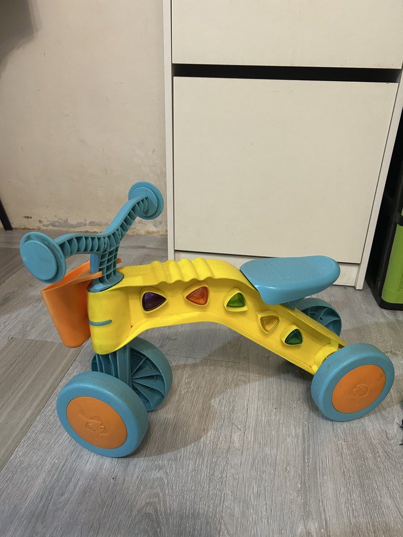Chillafish Itsibitsi 4-Wheel Ride-on (Category: Infant Playtime) located in Cavite. Submitted by proud.ausome.mama (Listing ID 1435331272, Image 1). Description: Bought this in Toy Kingdom. Not something my ausome kid wants. Trampoline pa din 😄 For Sale! Used but not abused. Send me your offer! - Chillafish Itsibitsi ride-on toy. - Bright yellow frame with blue wheels and seat. - Includes a small orange basket. - Designed with four wheels for en