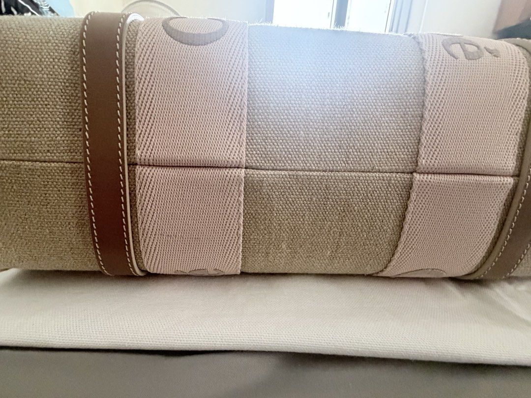 Chloe Woody Tote Bag (Category: Luxury Bags & Wallets) located in Makati City. Submitted by rain3dr0ps (Listing ID 1435183157, Image 3). Description: - Chloe Woody tote bag medium - Beige (blushy beighe color) - Brown leather trim - Double top handles - Spacious interior - Chloe logo embroidered on straps - used a few times with dustbag and paperbag - pick up in Chino Roces Makati - payment via BPI QR only .