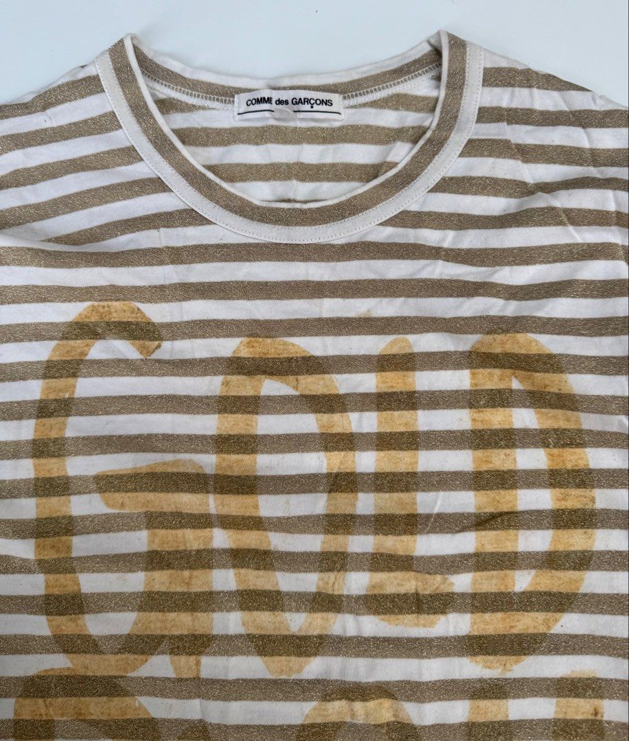Comme des Garcons - Glittered Gold Rush Longsleeves (Category: Longsleeves) located in Caloocan City. Submitted by opulent.finds (Listing ID 1435241810, Image 2). Description: Medium on tag (unisex) Width: 20” Lenght: 28” 9/10 condition Flaw: faded print, still in good condition.