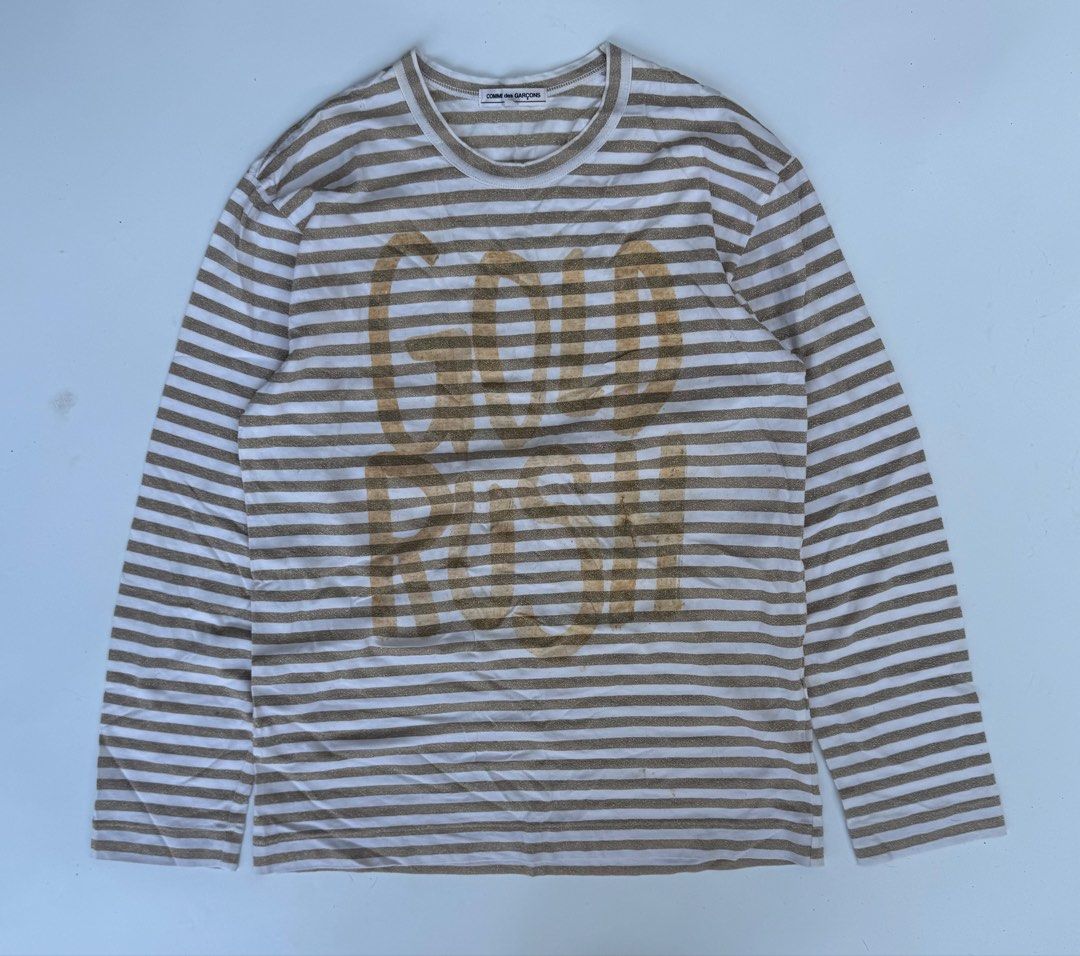 Comme des Garcons - Glittered Gold Rush Longsleeves (Category: Longsleeves) located in Caloocan City. Submitted by opulent.finds (Listing ID 1435241810, Image 1). Description: Medium on tag (unisex) Width: 20” Lenght: 28” 9/10 condition Flaw: faded print, still in good condition.
