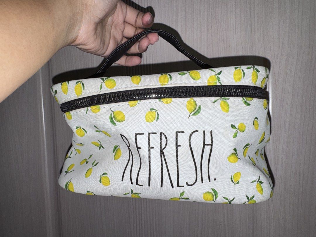 Cosmetic Travel Bag (Category: Purses & Pouches) located in Angeles City. Submitted by cocomademedo8 (Listing ID 1435261130, Image 1). Description: - Cheerful lemon print design - Black zipper closure - Convenient handle for carrying - Black interior with multiple compartments - Perfect for makeup, skincare, and small items - Great for travel or everyday use.