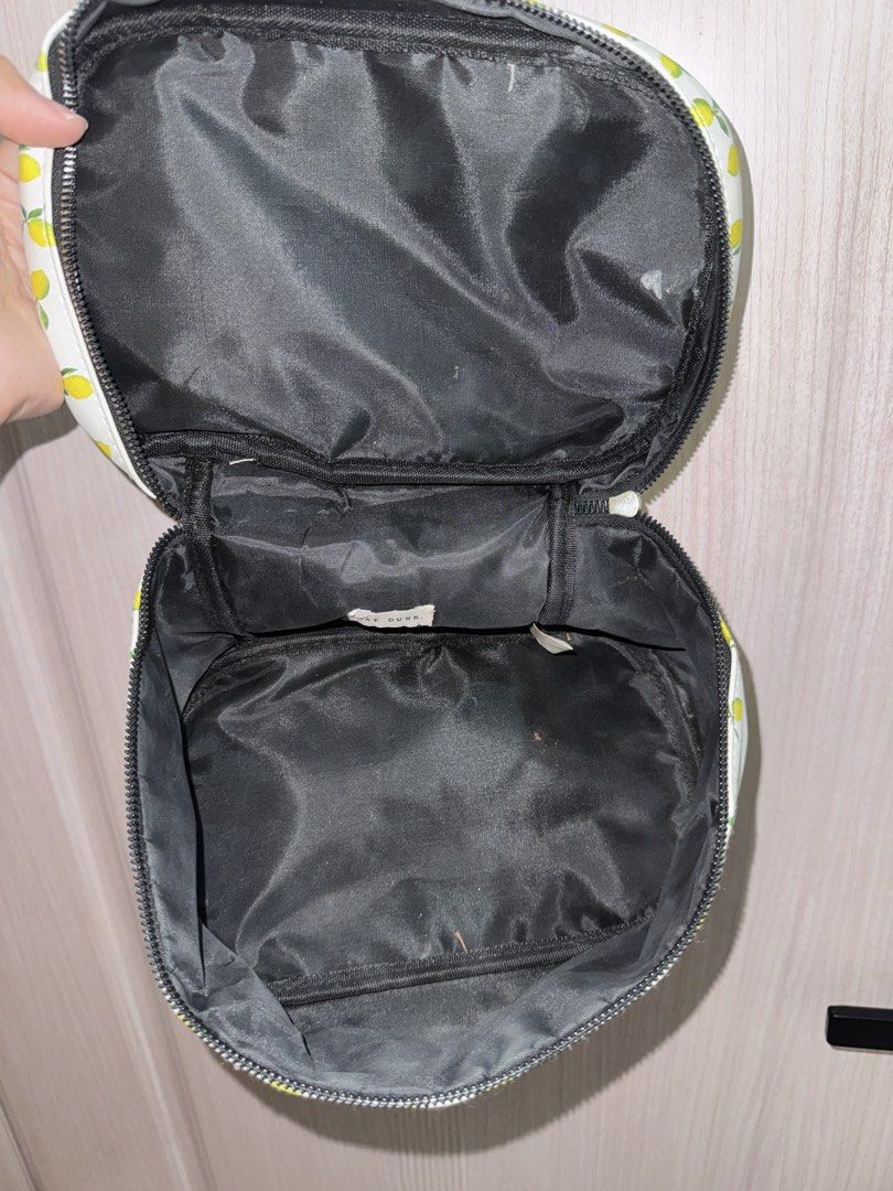 Cosmetic Travel Bag (Category: Purses & Pouches) located in Angeles City. Submitted by cocomademedo8 (Listing ID 1435261130, Image 2). Description: - Cheerful lemon print design - Black zipper closure - Convenient handle for carrying - Black interior with multiple compartments - Perfect for makeup, skincare, and small items - Great for travel or everyday use.