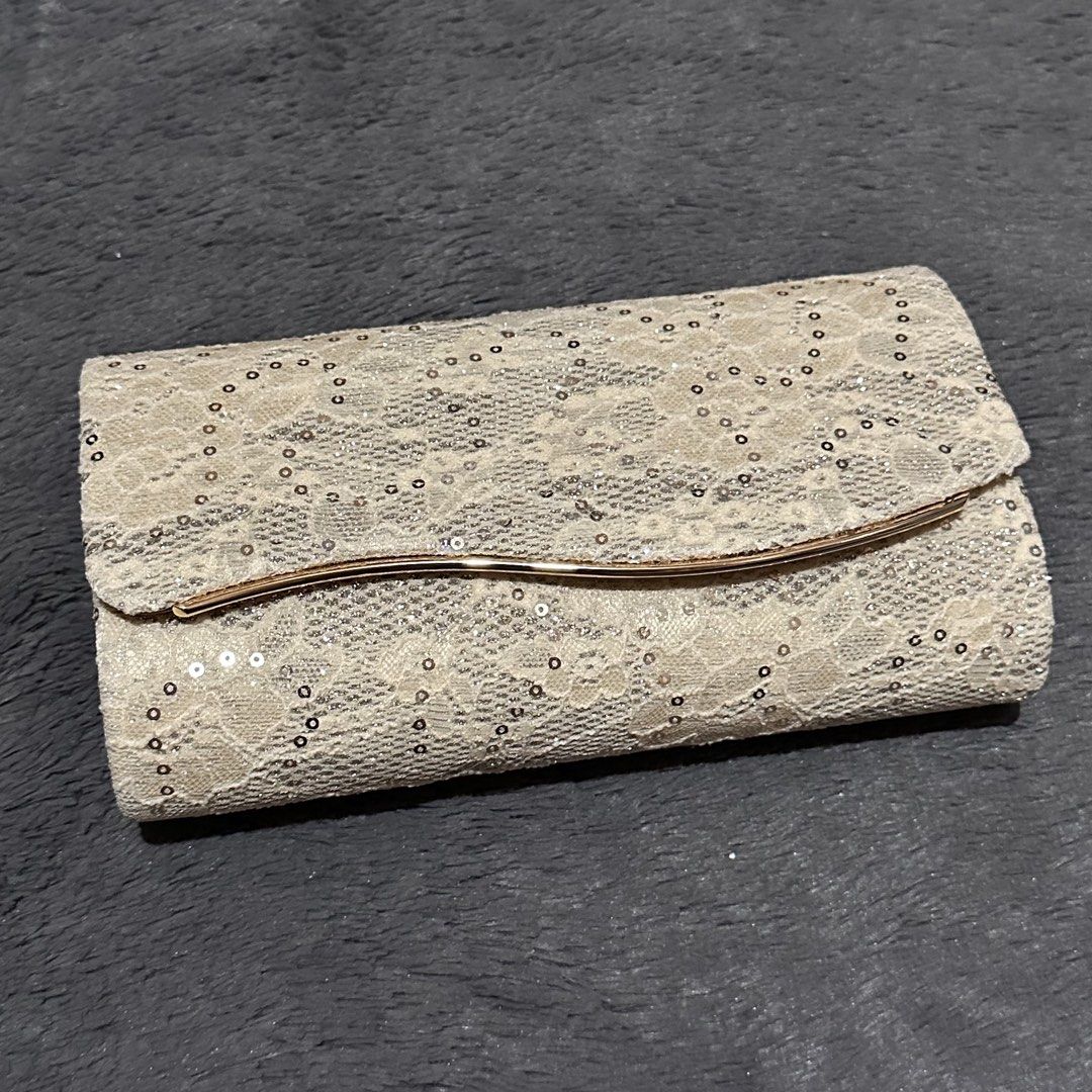 Cream lace wedding or party cluth bag (Category: Clutches) located in Marikina City. Submitted by sol.collective (Listing ID 1435294387, Image 1). Description: ▪️spacious ▪️can fit up to iPhone Pro Max ▪️color varies from different lighting (may look darker on actual) ▪️actual photos of product posted ▪️can do same-day delivery Discounted price posted already. Original price from ₱ 1200 BPI or GCash.