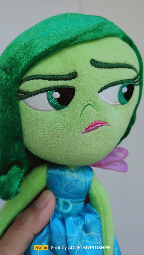 Disney Pixar | Inside Out, Disgust plush (Category: Plushies & Soft Toys) located in Taguig. Submitted by adopt.my.plush.ph (Listing ID 1435296878, Image 2). Description: Official Disgust Plush from Disney and Pixar's movie Inside Out. This specific 11-inch version was released as part of the authentic Disney Store collection. Product Details Character: Disgust, known for her sassy personality and green appearance. Size: Approximately 11 inches (