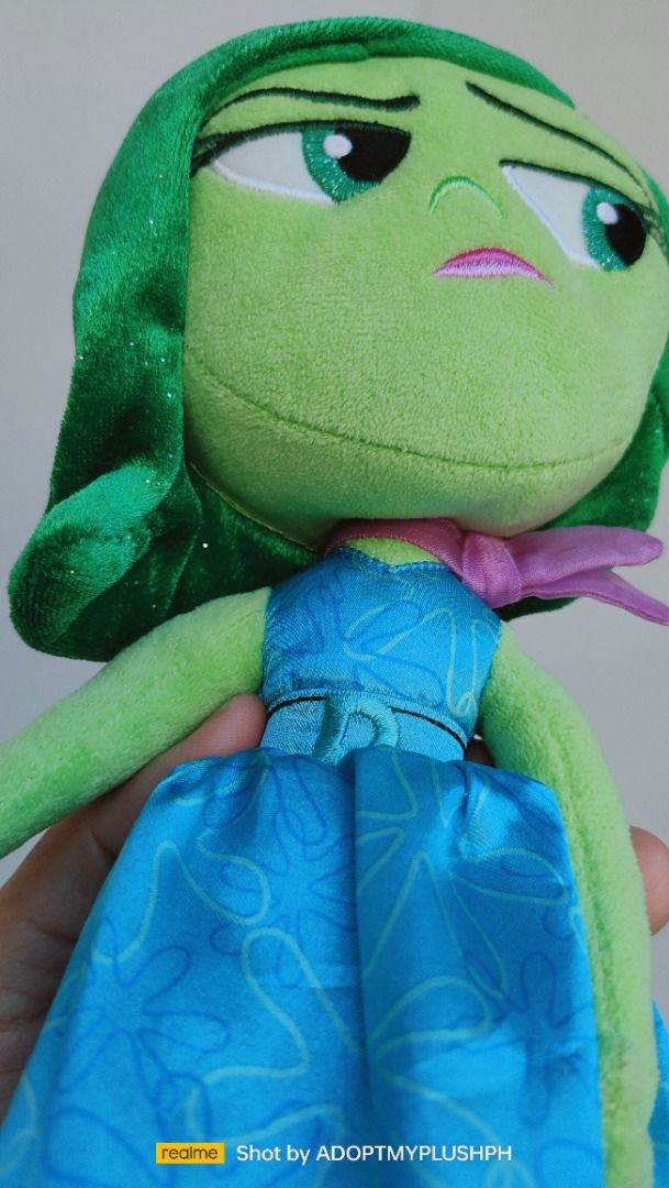Disney Pixar | Inside Out, Disgust plush (Category: Plushies & Soft Toys) located in Taguig. Submitted by adopt.my.plush.ph (Listing ID 1435296878, Image 3). Description: Official Disgust Plush from Disney and Pixar's movie Inside Out. This specific 11-inch version was released as part of the authentic Disney Store collection. Product Details Character: Disgust, known for her sassy personality and green appearance. Size: Approximately 11 inches (