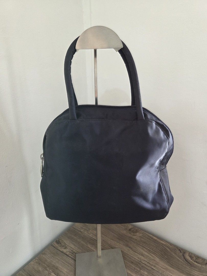Esprit Navy Handbag (Category: Purses & Pouches) located in General Trias. Submitted by ClutterCrunch (Listing ID 1435195162, Image 3). Description: - Navy Esprit handbag - Top zipper closure - Dual handles - Interior zippered pocket - Made of 100% nylon - Esprit logo on zipper pull - In excellent condition Shipping c/o buyer, thru lalamove or J&T Express MOP: GCash/BDO Decluttering sale: Mix of my own items and my mother's preloved pieces. Locat