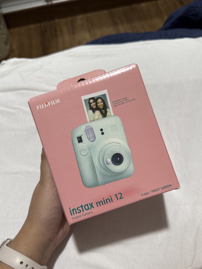 Fujifilm Instax Mini 12 - Mint Green (Category: Cameras) located in Quezon City. Submitted by aebb__ (Listing ID 1435287358, Image 2). Description: - Fujifilm Instax Mini 12 instant camera - Color: Mint Green - Includes original box - Includes clear protective case - no issues no dents - good as new.