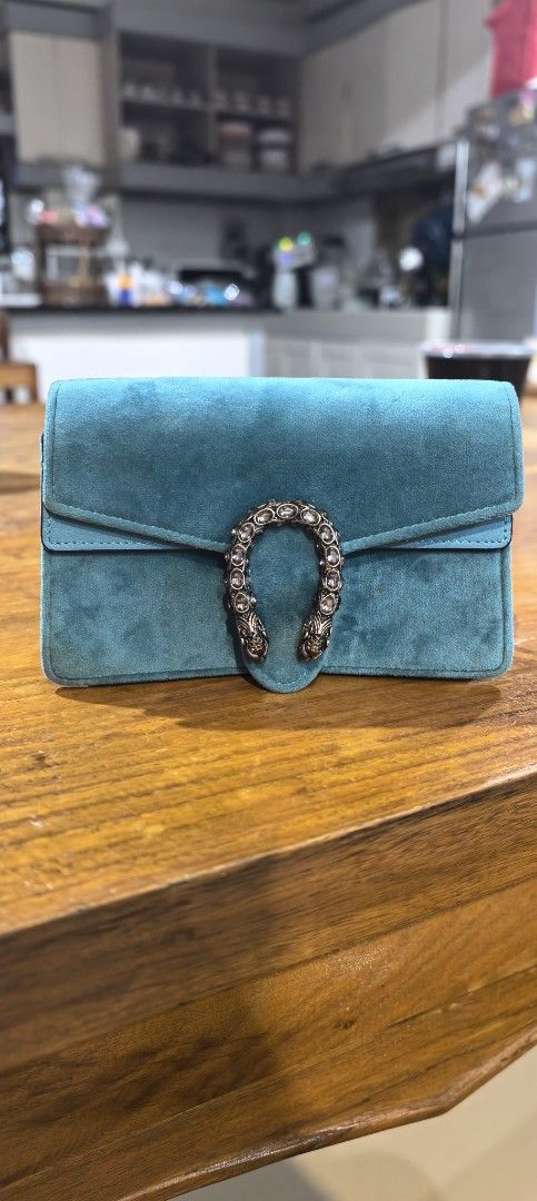 Gucci Dionysus Suede Shoulder Bag (Category: Luxury Bags & Wallets) located in Cagayan de Oro. Submitted by tommygurl1218 (Listing ID 1435265579, Image 1). Description: - Authentic Gucci Dionysus shoulder bag - Beautiful teal suede - Iconic tiger head closure - Snap button with Gucci logo - Light blue leather lining - Serial number: 476432-4171 - Perfect for any occasion.