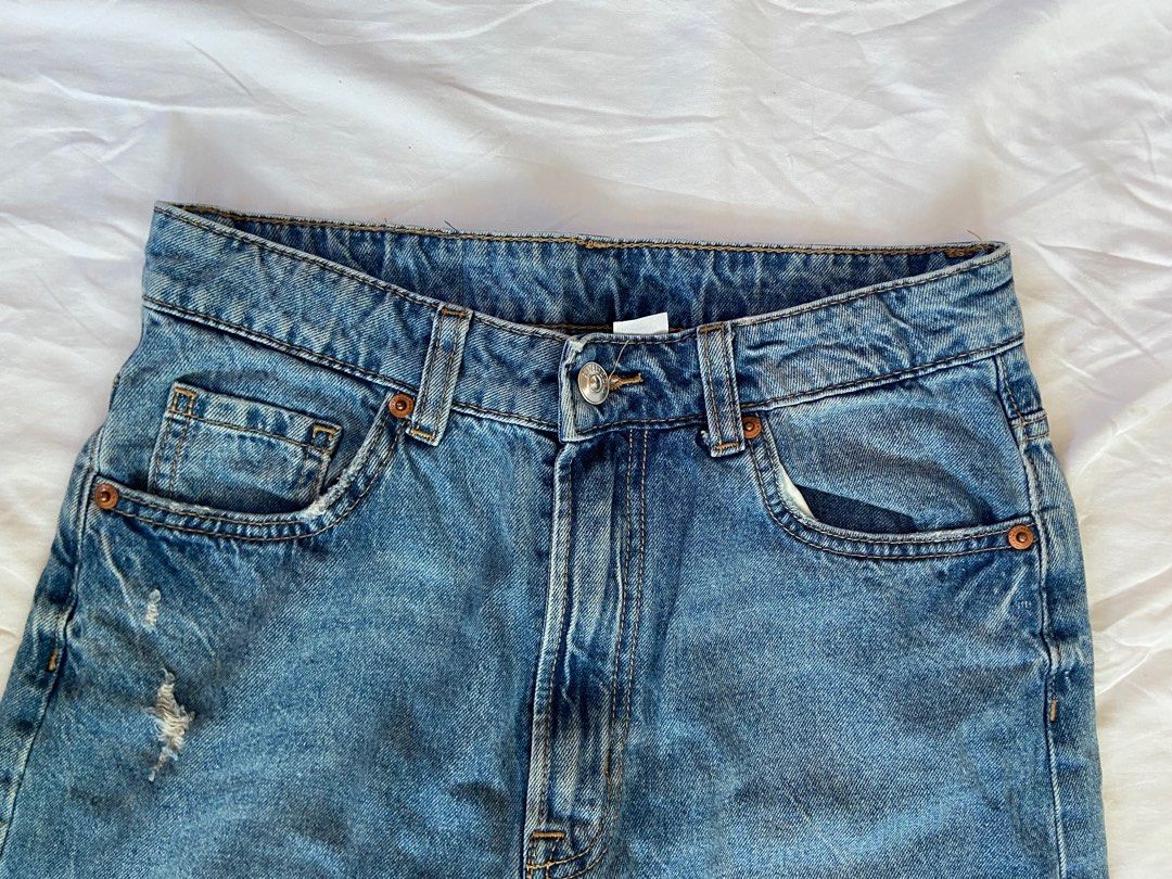H&M (DIVIDED) - Wide Leg Jeans (Category: Jeans) located in Legazpi City. Submitted by clutterbusterph (Listing ID 1435280466, Image 3). Description: SURE BUYERS ONLY measurements: waist: 26 inches hips: 32 inches length: 41.5 inches - Light blue wash - Distressed details - High-waisted - Relaxed wide-leg fit - Button and zipper closure.