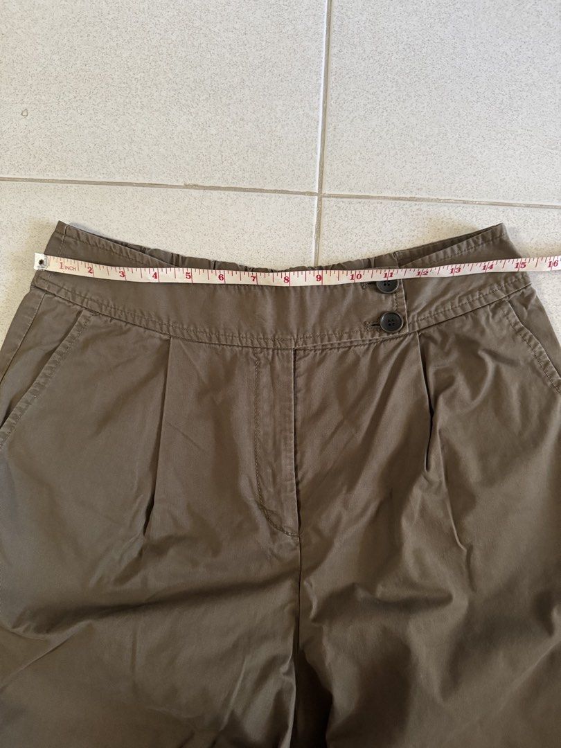 Japandi Style Greenish Brown Pleated Pants (Category: Other Bottoms) located in Bacoor. Submitted by engreedy (Listing ID 1435227456, Image 2). Description: - Brown pleated pants - Button closure - Waist: 16 inches - Length: 33 inches - Relaxed fit - Lightweight fabric - Perfect for casual wear.
