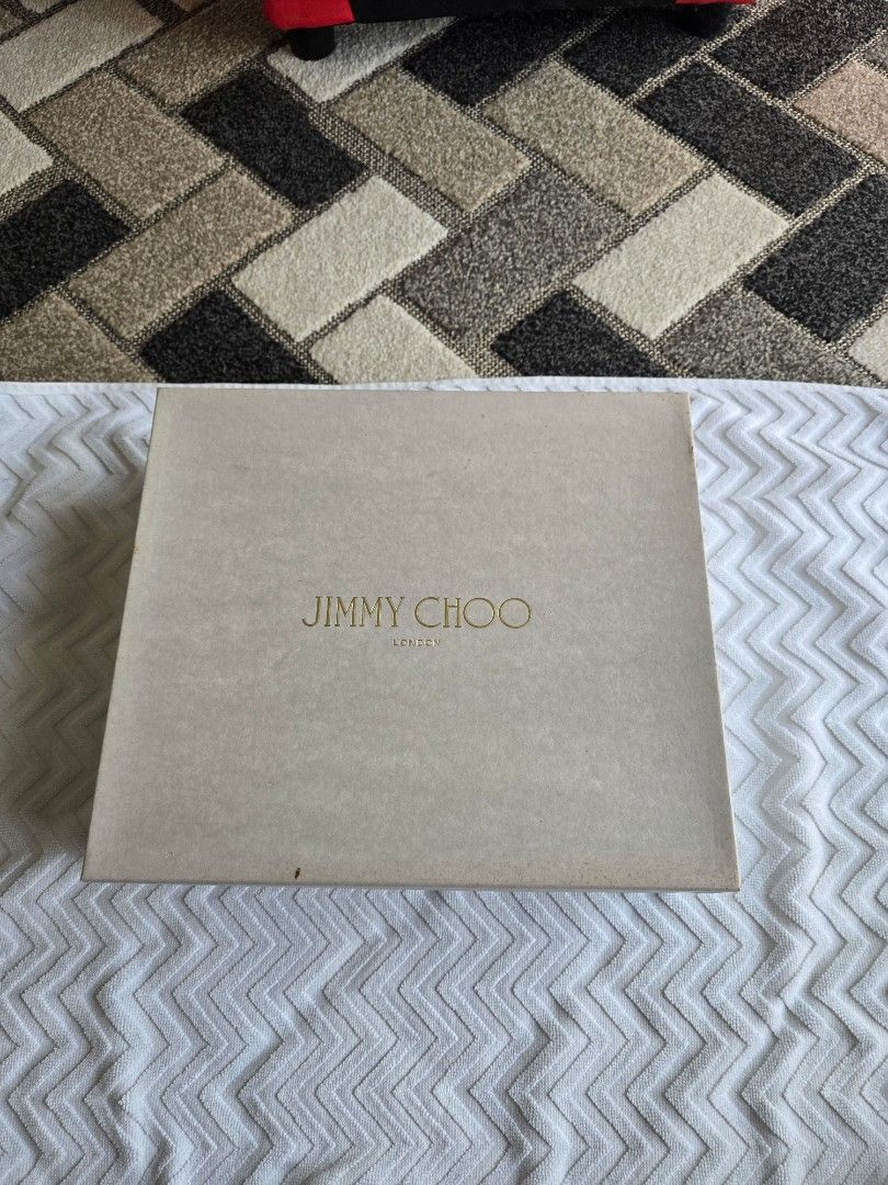 Jimmy Choo White Leather Sandals (Category: Flats & Sandals) located in Santa Rosa. Submitted by brightstar2212 (Listing ID 1435179595, Image 1). Description: - Jimmy Choo sandals - White leather - Brown heel - Gold accents - Original box included - Strap closure - Adds luxury to any outfit.