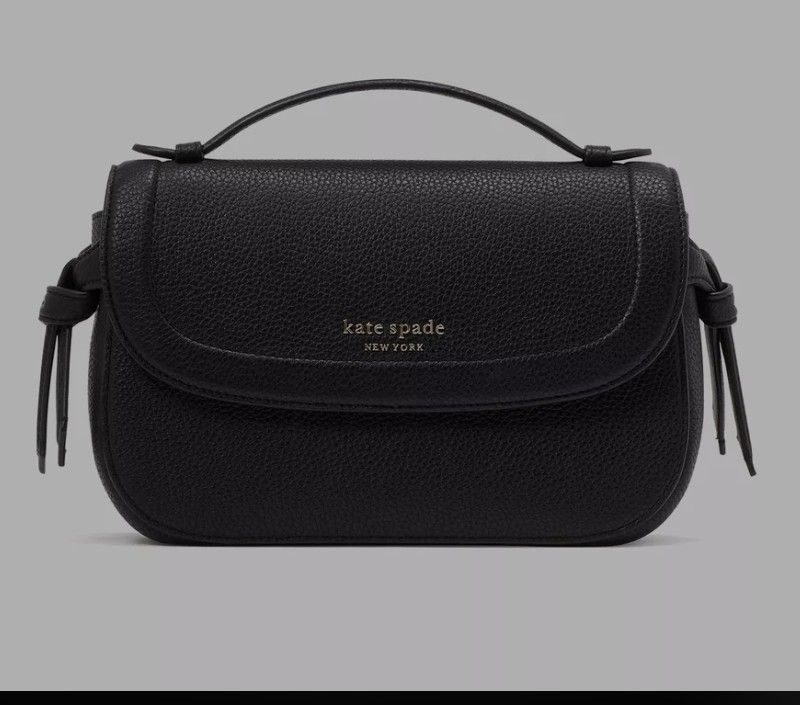 Kate spade Knott Top-handle Crossbody (Category: Cross-body Bags) located in Paranaque City. Submitted by jerrylr (Listing ID 1435297236, Image 1). Description: (With free Small bag insert) Measurements • Length: 3.5" • Height: 6.0" • Width: 9.75" Materials • Pebbled leather • Faille lining Handle • 1.26 - inch handle drop length Strap • Strap drop: 22" Features • Exterior slip pocket • Interior zip pocket, Interior slip pocket • Magnetic snap fl
