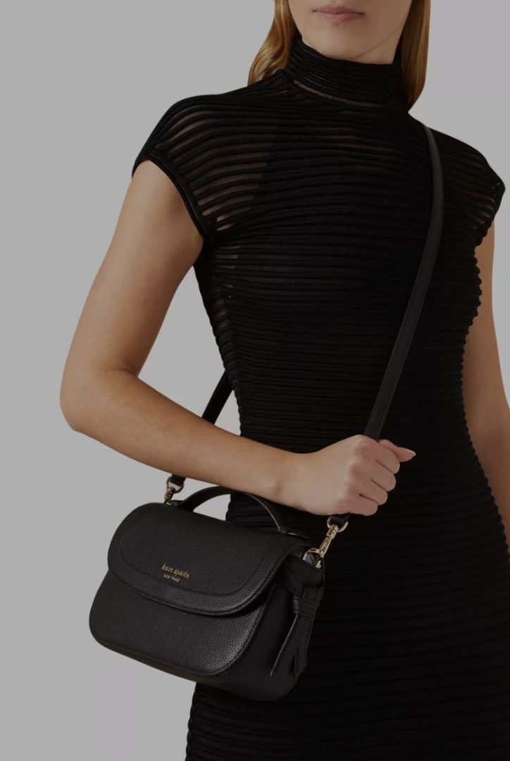 Kate spade Knott Top-handle Crossbody (Category: Cross-body Bags) located in Paranaque City. Submitted by jerrylr (Listing ID 1435297236, Image 2). Description: (With free Small bag insert) Measurements • Length: 3.5" • Height: 6.0" • Width: 9.75" Materials • Pebbled leather • Faille lining Handle • 1.26 - inch handle drop length Strap • Strap drop: 22" Features • Exterior slip pocket • Interior zip pocket, Interior slip pocket • Magnetic snap fl