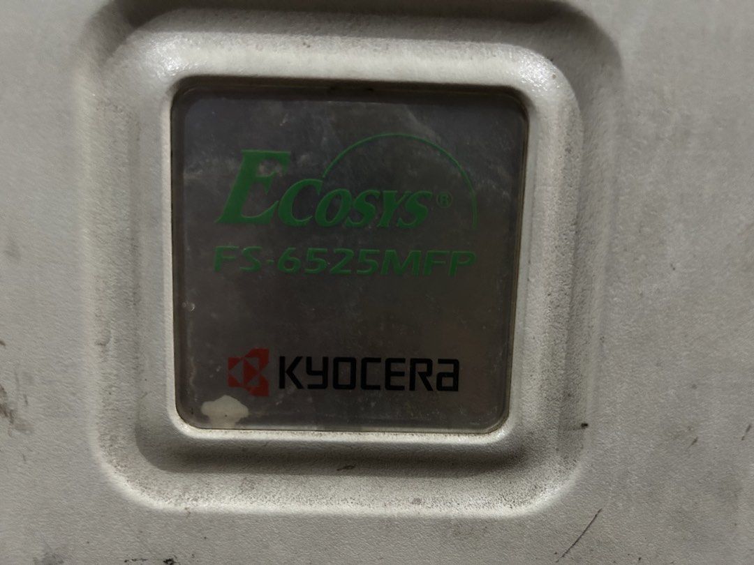 Kyocera ECOSYS FS-6525MFP Printer (Category: Printers, Scanners & Copiers) located in Manila. Submitted by gettybyrina (Listing ID 1435230796, Image 3). Description: - Kyocera ECOSYS FS-6525MFP - Multi-function printer: copy, fax, and send - Supports A4 and A3 paper sizes - Features a document feeder - Includes a paper tray - Numeric keypad and control buttons - Display screen on control pane Issue: need palitan ung stand para mahold nya un copie