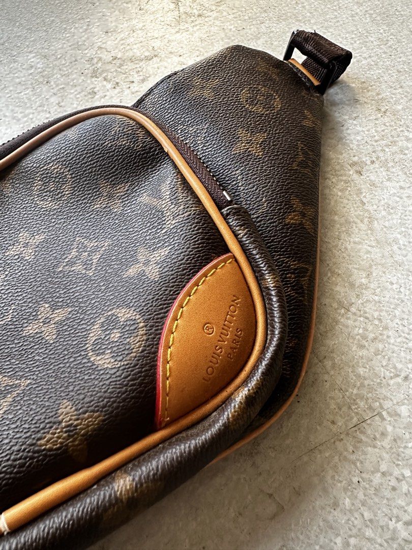 Louis Vuitton Monogram Waist Bag (Category: Luxury Bags & Wallets) located in Manila. Submitted by revineapprl (Listing ID 1435304252, Image 2). Description: Authentic Louis Vuitton waist bag in the classic Monogram pattern. Features multiple compartments, including a front pocket with a flap closure and a zippered main compartment. Adjustable strap for a comfortable fit. The bag showcases the iconic LV monogram throughout. Includes a small leath