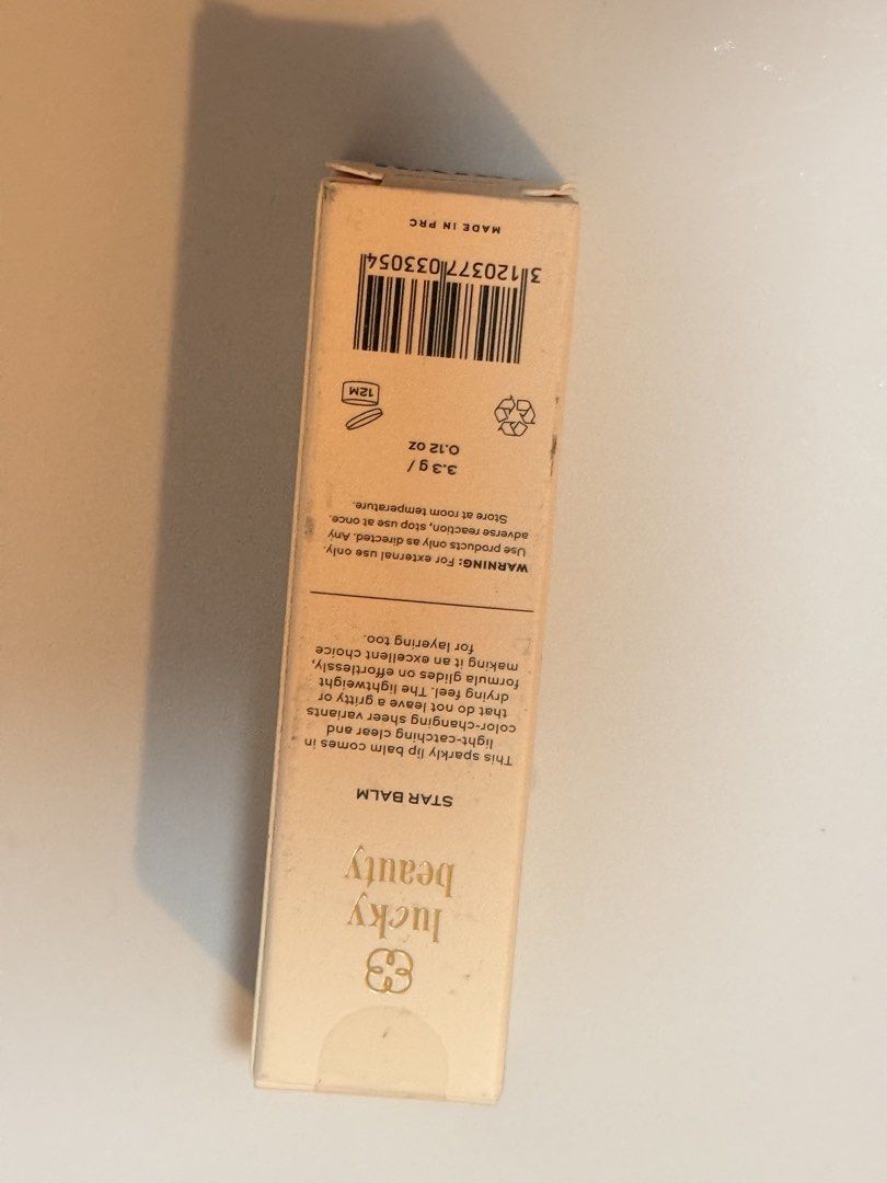 Lucky Beauty Star Balm (Category: Makeup) located in Lucena. Submitted by fashioncult.ph (Listing ID 1435174829, Image 3). Description: Lucky Beauty Star Balm is a sparkly lip balm that comes in a light, clear, and color-changing shine. It is an excellent choice for layering too. The formula glides on effortlessly, leaving a light, non-drying feel. It does not leave a gritty or color-changing shine. The balm is 3.3g / 0.12 oz..