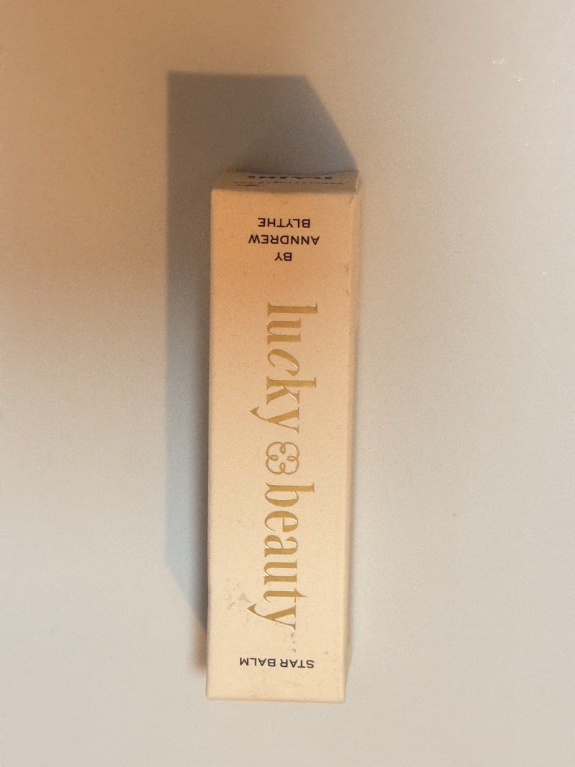 Lucky Beauty Star Balm (Category: Makeup) located in Lucena. Submitted by fashioncult.ph (Listing ID 1435174829, Image 1). Description: Lucky Beauty Star Balm is a sparkly lip balm that comes in a light, clear, and color-changing shine. It is an excellent choice for layering too. The formula glides on effortlessly, leaving a light, non-drying feel. It does not leave a gritty or color-changing shine. The balm is 3.3g / 0.12 oz..