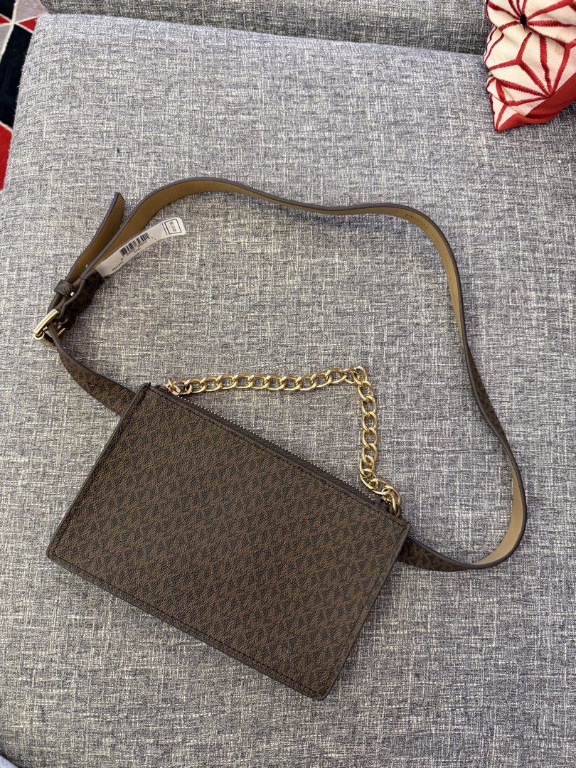 Michael Kors Belt Bag with Chain (Category: Luxury Bags & Wallets) located in San Jose. Submitted by affordabletrendsby_cai (Listing ID 1435179628, Image 1). Description: - Michael Kors belt bag - Brown monogram pattern - Gold chain detail - Matching brown belt - Rectangular shape - Zipper closure - Made with synthetic materials - Original price: "$55".