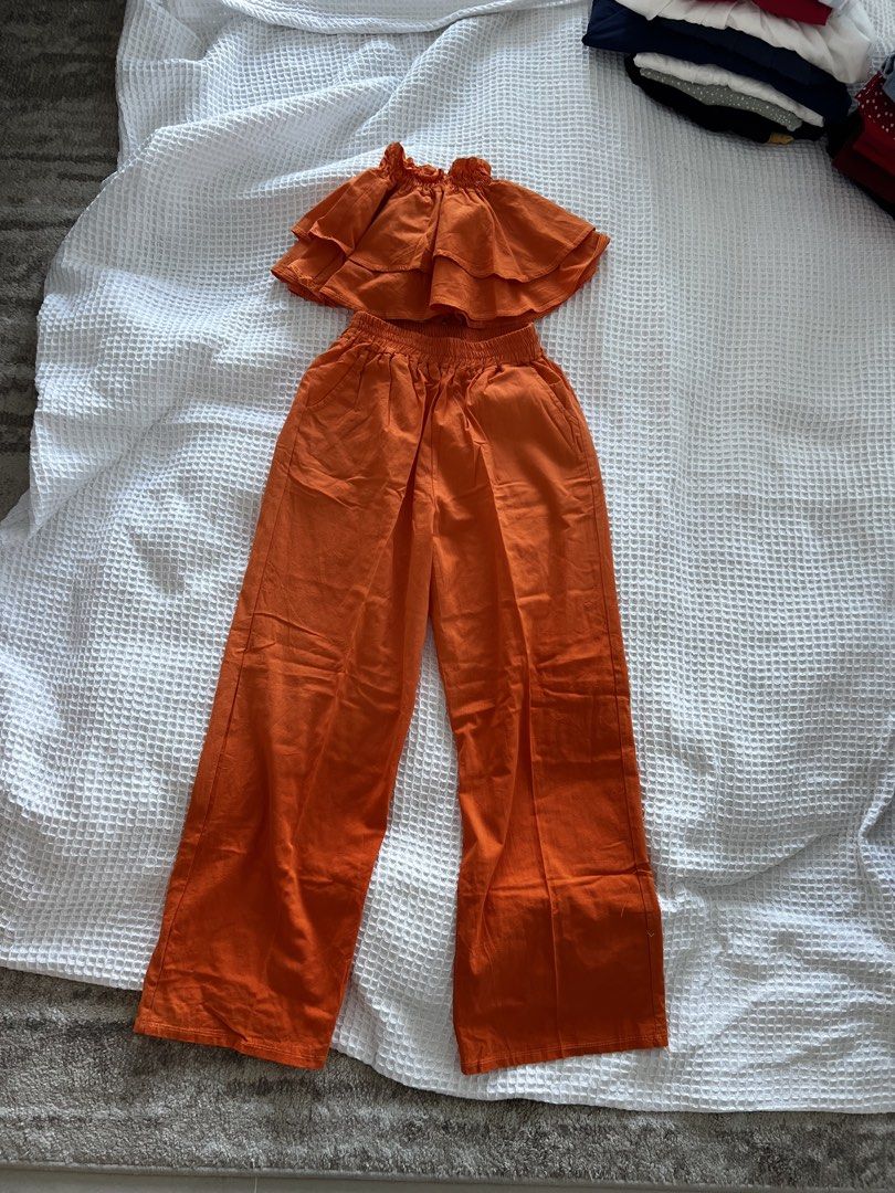 Orange Jumpsuit (Category: Sets or Coordinates) located in Manila. Submitted by thejenclai01765 (Listing ID 1435325067, Image 1). Description: BNEW JUST STORED - Orange jumpsuit set - Includes top and wide-leg pants - Size S - Ready to wear.